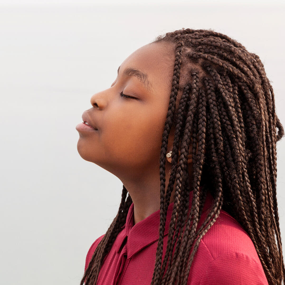 Position A photo of a woman from the side, with her chin elevated.